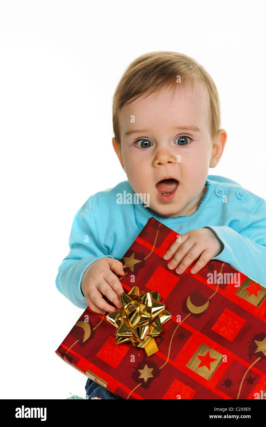 Little kid with a birthday gift package Stock Photo