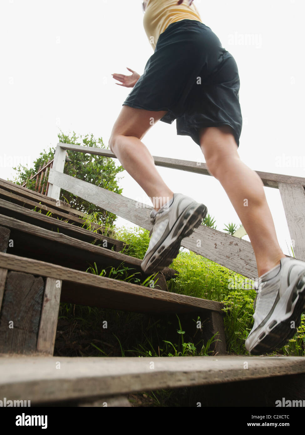 Caucasian woman running up stairs for exercise Stock Photo Alamy