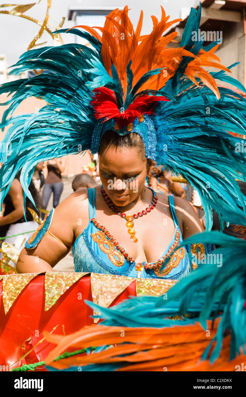 Woman in a turquoise feathered costume in the Port of Spain carnival in Trinidad. Stock Photo