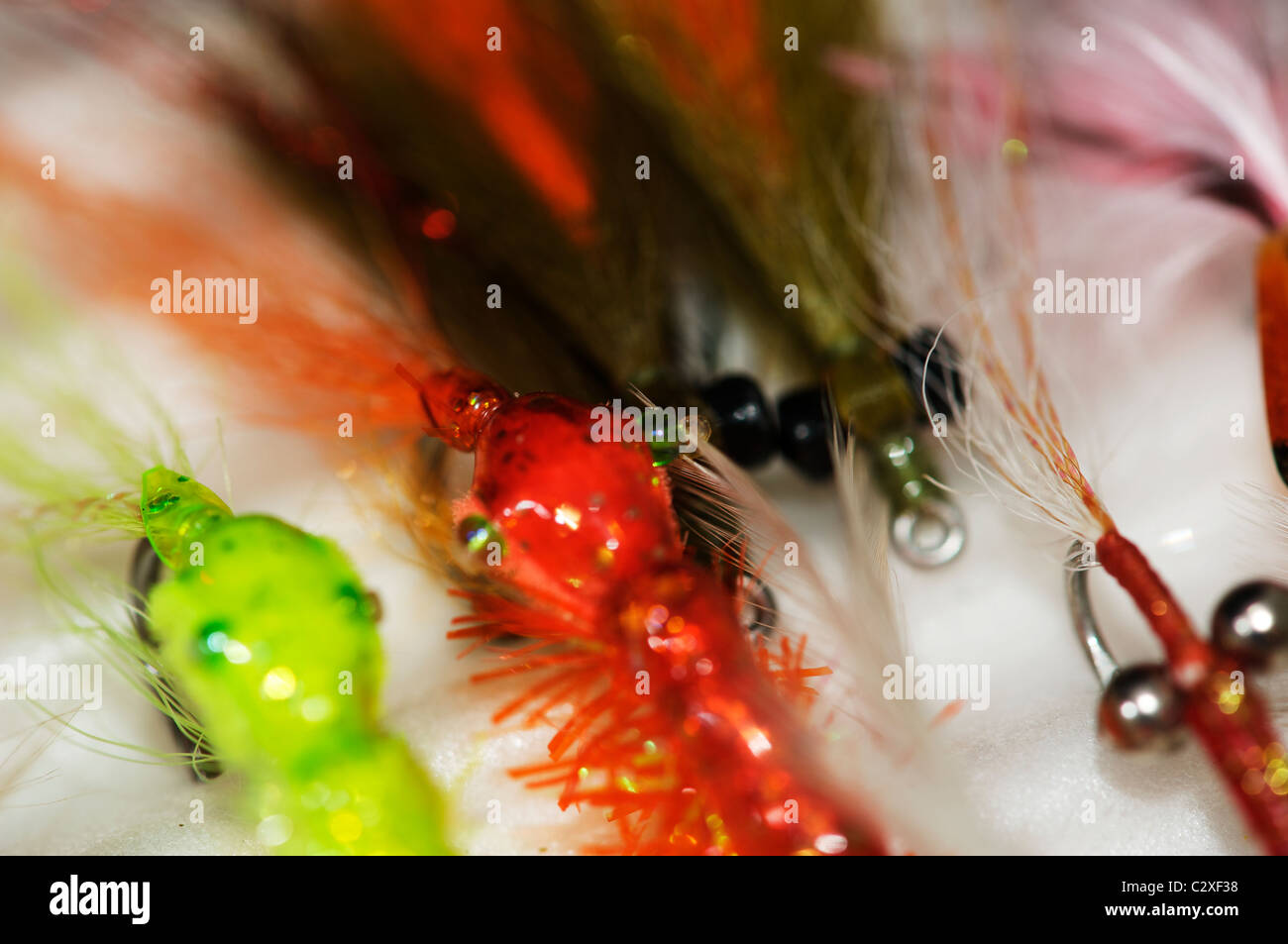 Saltwater fishing flies displayed on a ripple foam board Stock Photo