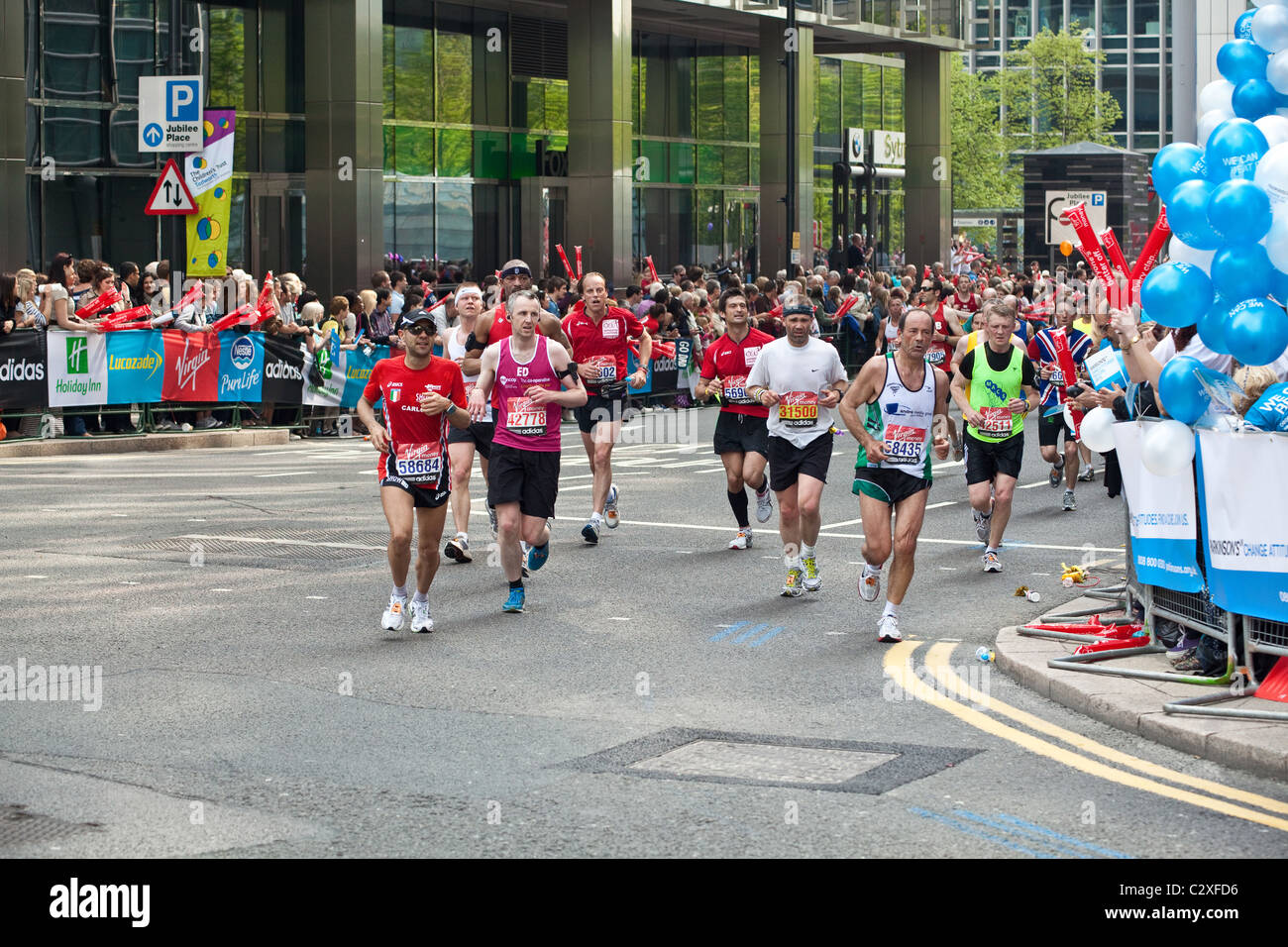 Fancy dress runners on the London Marathon 2011 at Canary Wharf, Docklands, London, England, United Kingdom. Stock Photo