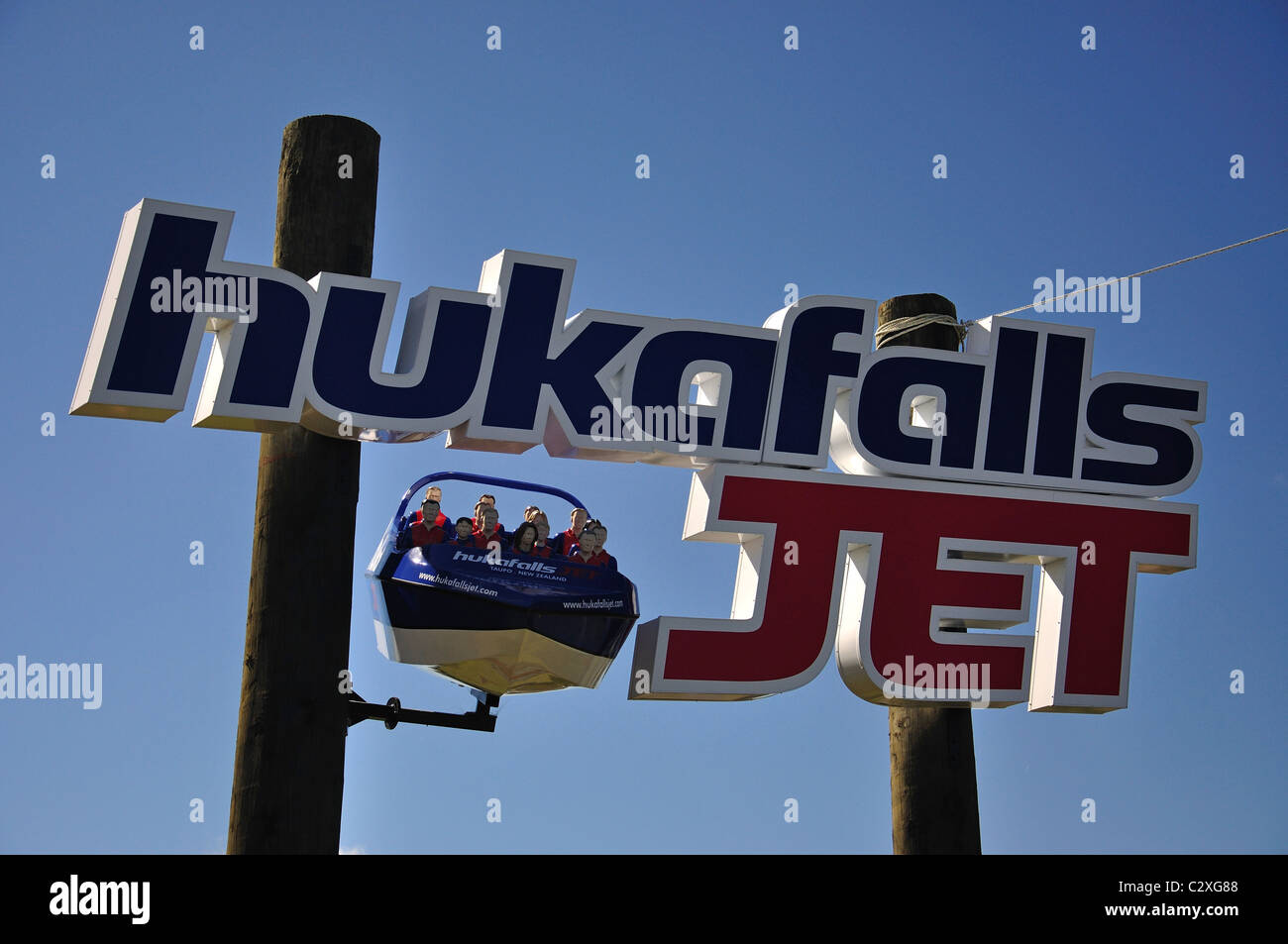 'Hukafalls Jet' sign for jetboat rides to Huka Falls, near Taupo, Waikato Region, North Island, New Zealand Stock Photo