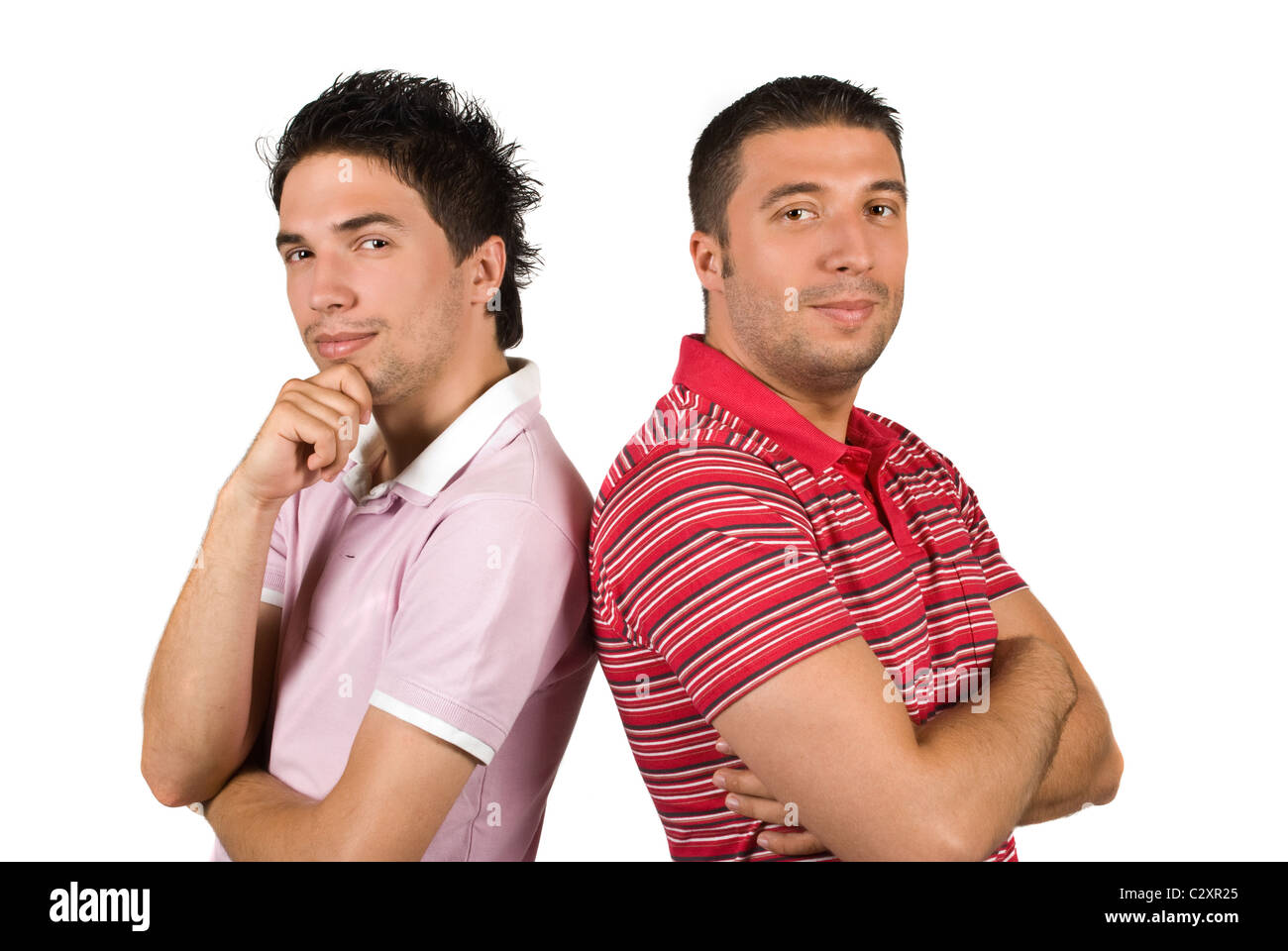 Cool two friends guys standing back to back with hands crossed and ...