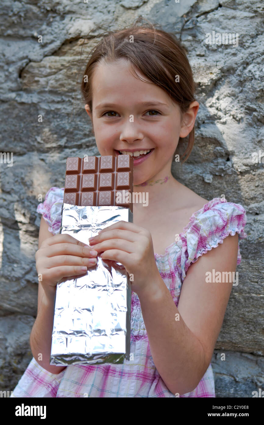 girl eating chocolate Stock Photo