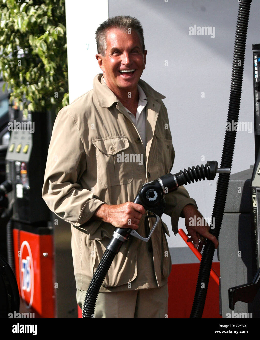 Hamilton fills up his car with gas at a 76 gas station Los