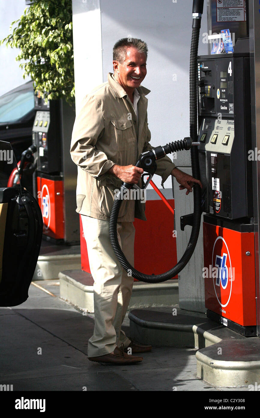 Hamilton fills up his car with gas at a 76 gas station Los