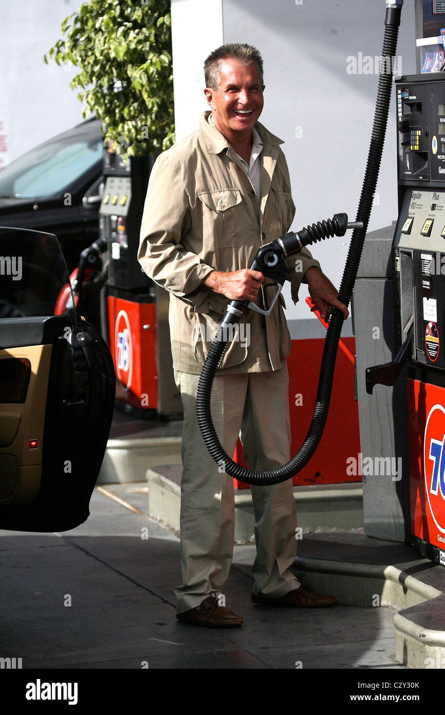 Hamilton fills up his car with gas at a 76 gas station Los