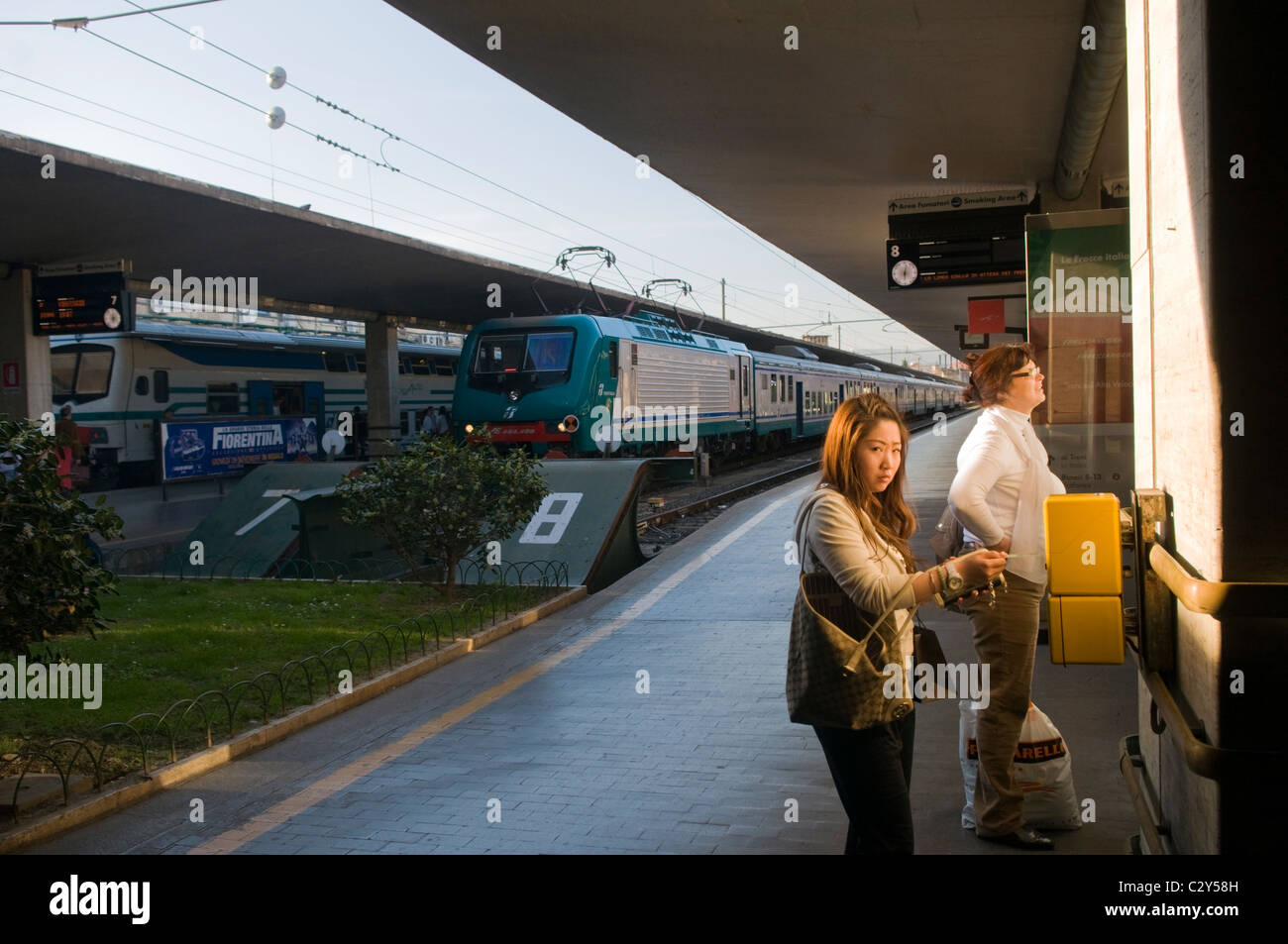 Florence Railway Station With Woman Validating a Train Ticket Stock Photo