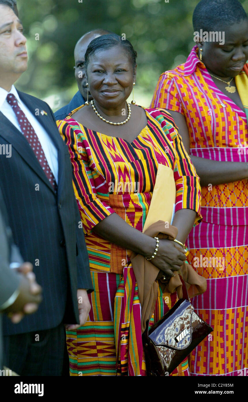 Theresa Mensah watches as President of Ghana John Kufuor and President George Bush address the media in the Rose Garden of the Stock Photo