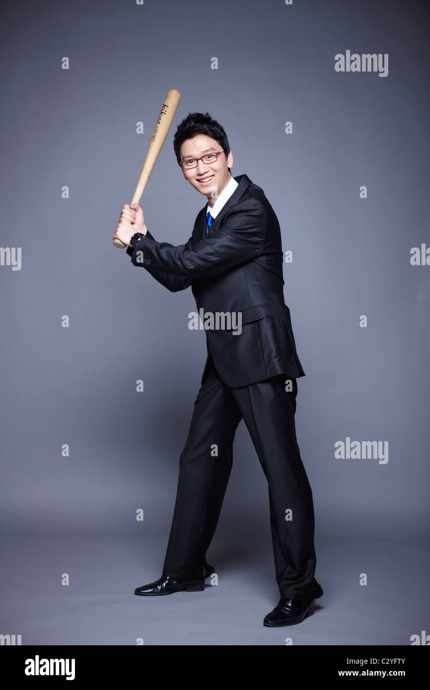 businessman posing swing baseball bat Stock Photo - Alamy