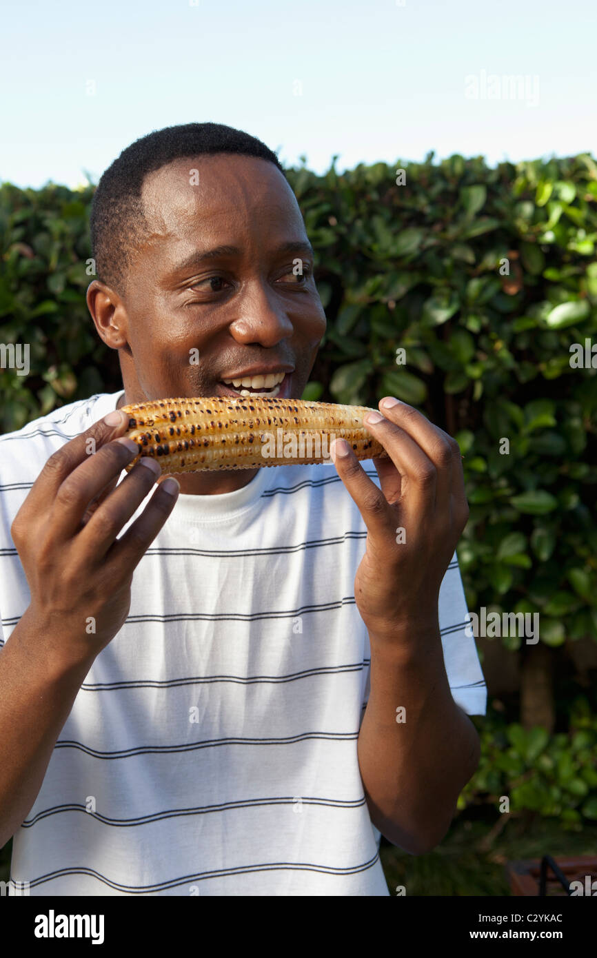 Man eating corn on the cob, Johannesburg, South Africa Stock Photo Alamy