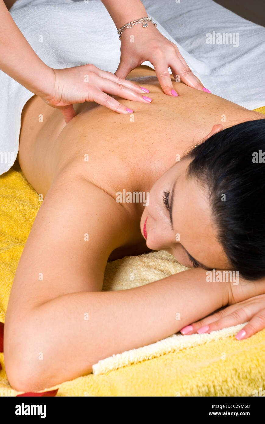 Young woman getting back massage at spa resort Stock Photo