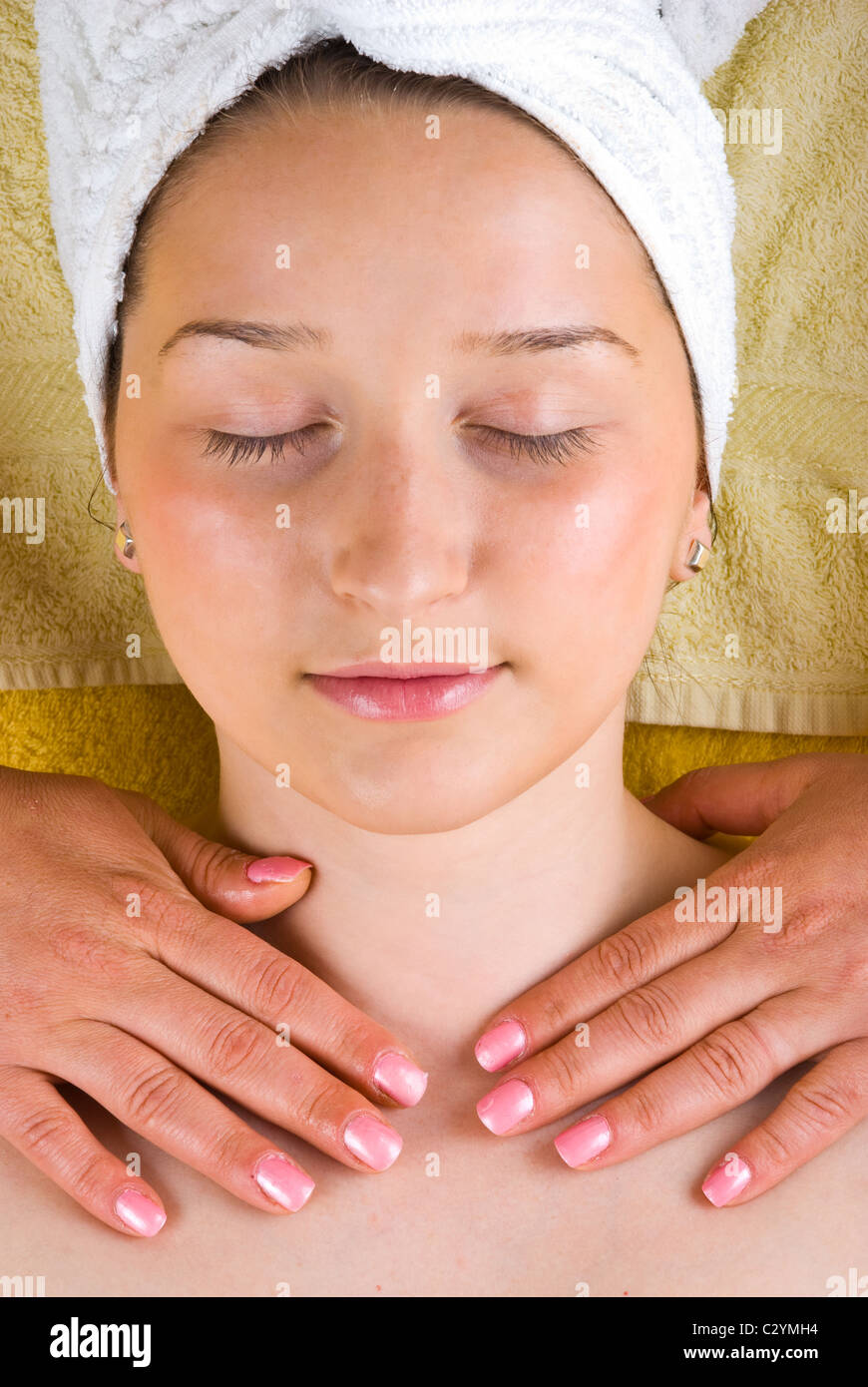 Young woman receiving a neck massage at spa salon Stock Photo