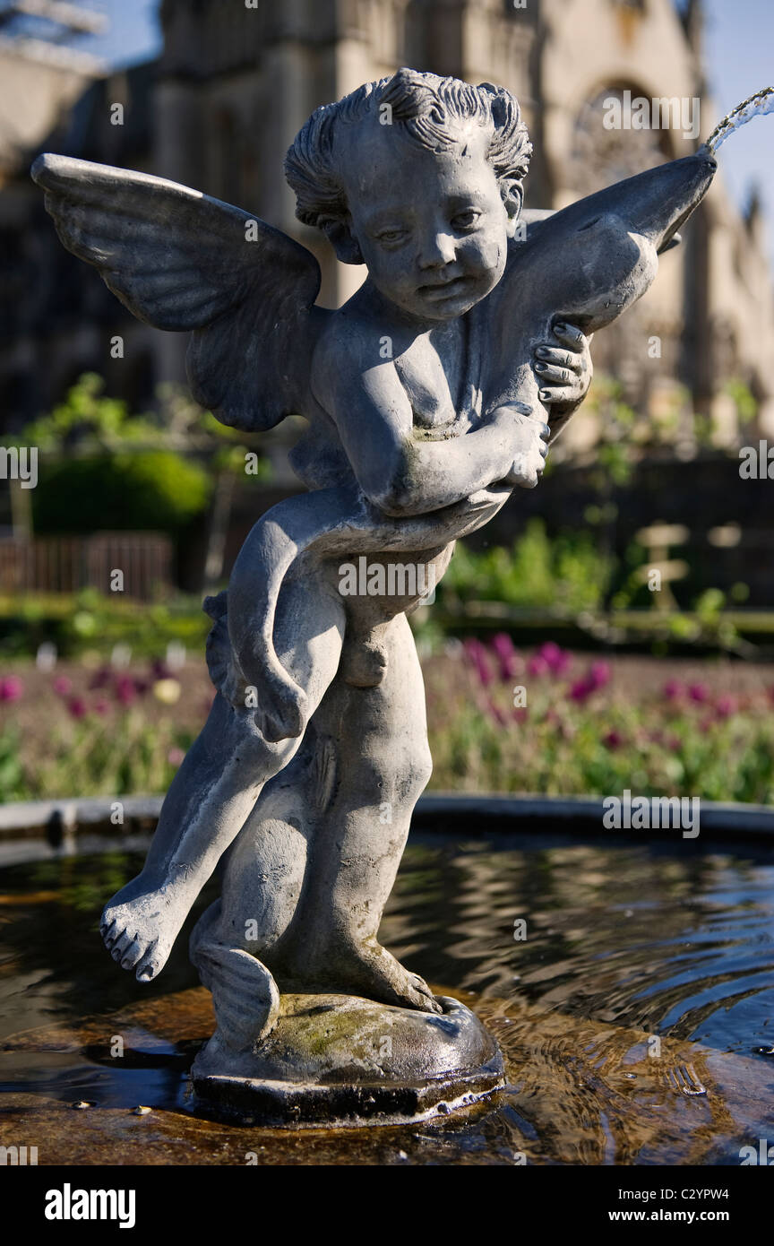 Fountain Statue of Eros in the Collector Earl's Garden, Arundel Castle with Arundel Cathedral in the Background, West Sussex, UK Stock Photo