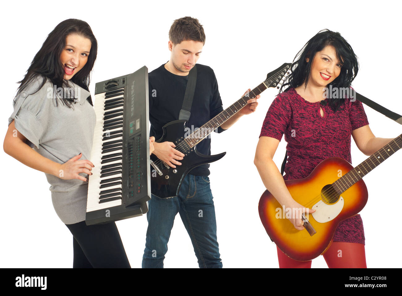 Cheerful musical band of three persons playing guitars and organ ...