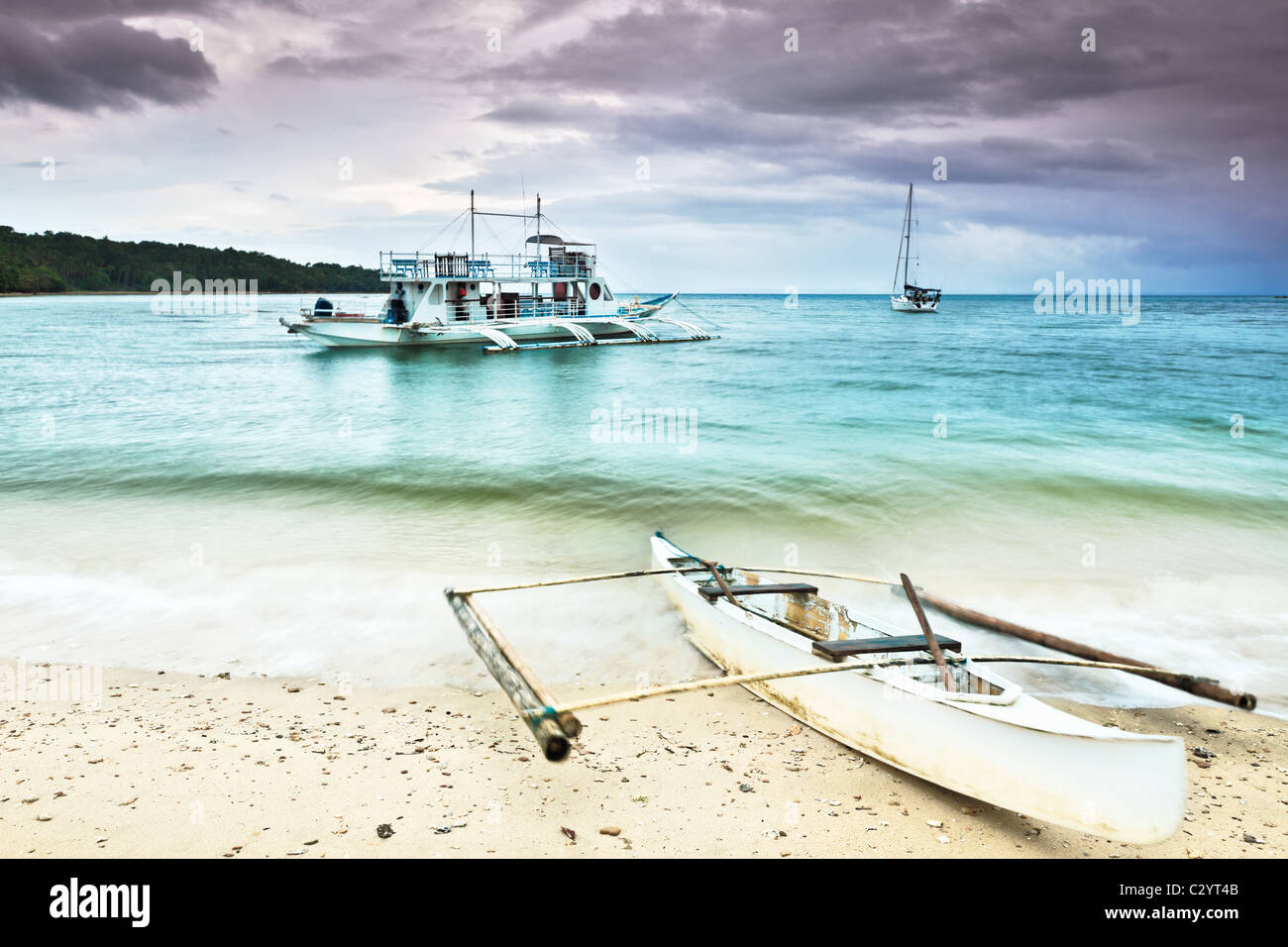 Traditional Philippine boat in the tropical lagoon Stock Photo