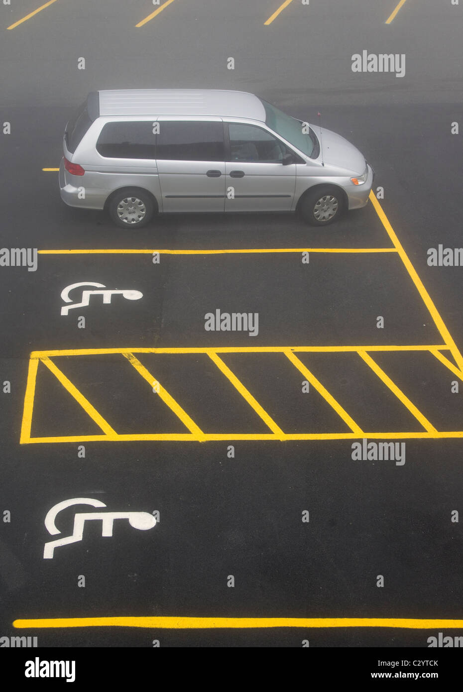 Empty handicapped parking spaces in a parking lot Stock Photo