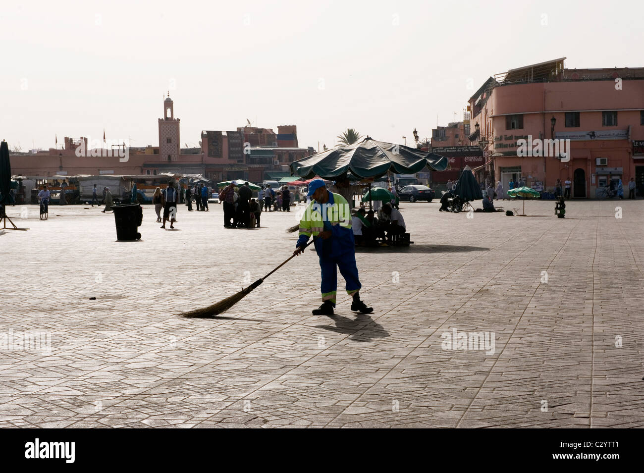 Marrakech, Morocco,15-4-2011. Sweeping the Place Djemaa el Fna in the early morning after the night market food stalls have pack Stock Photo