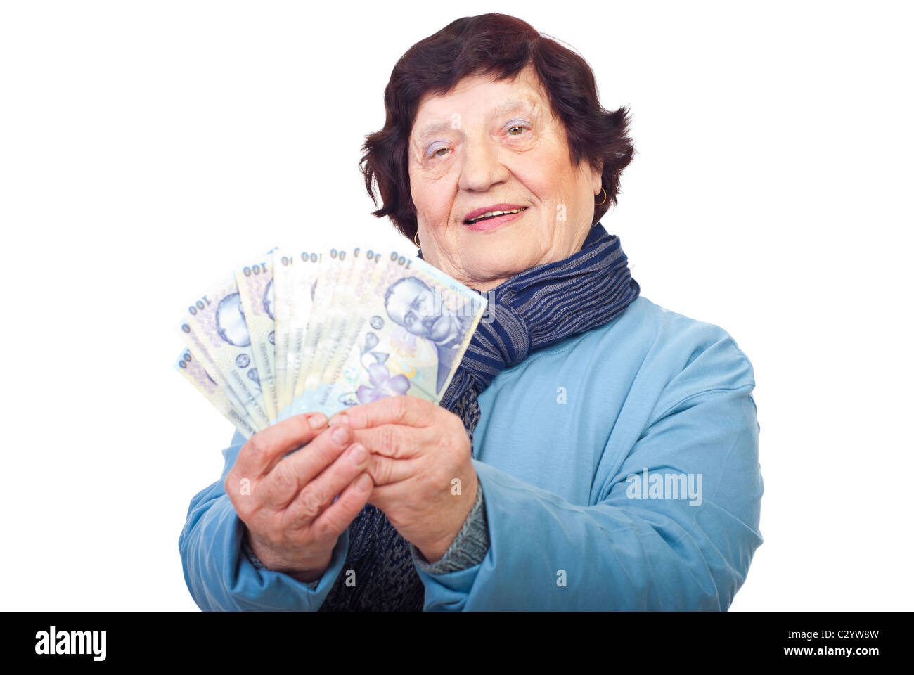 Smiling senior woman holding Romanian banknotes isolated on white background Stock Photo