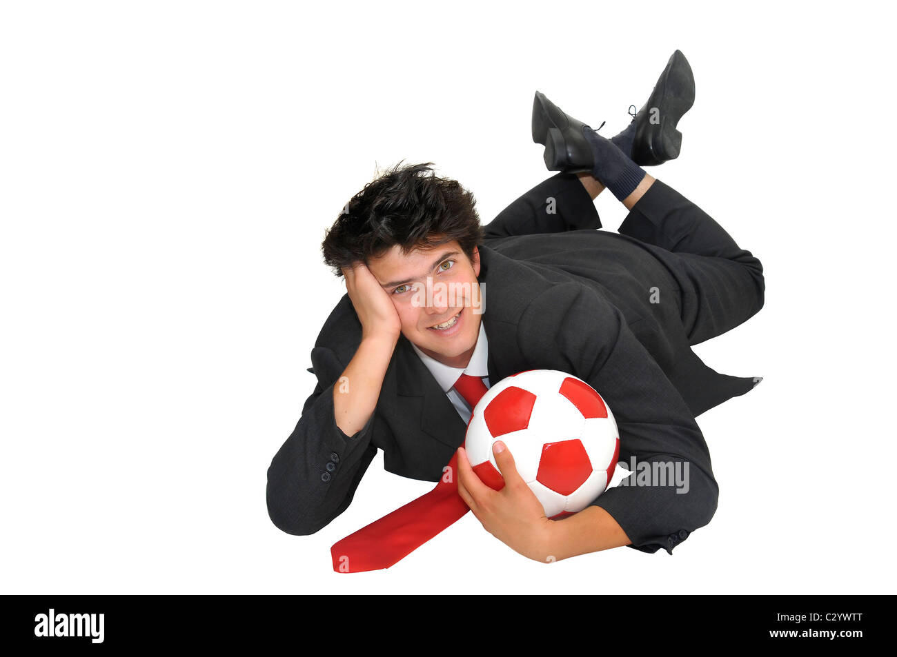 Businessman with a soccer ball isolated in white Stock Photo - Alamy