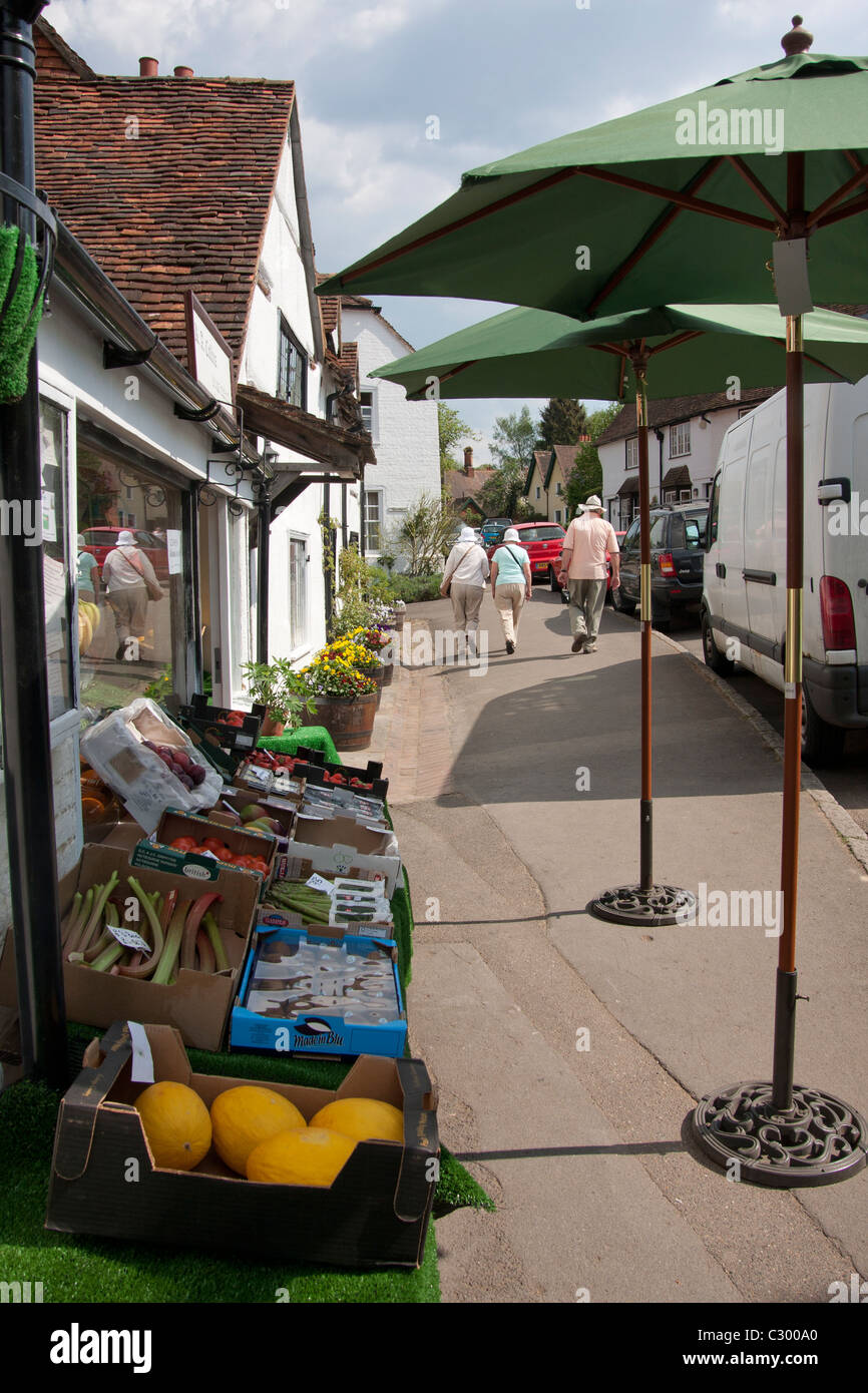 greengrocers and visitors walking in Shere town square, Guildford