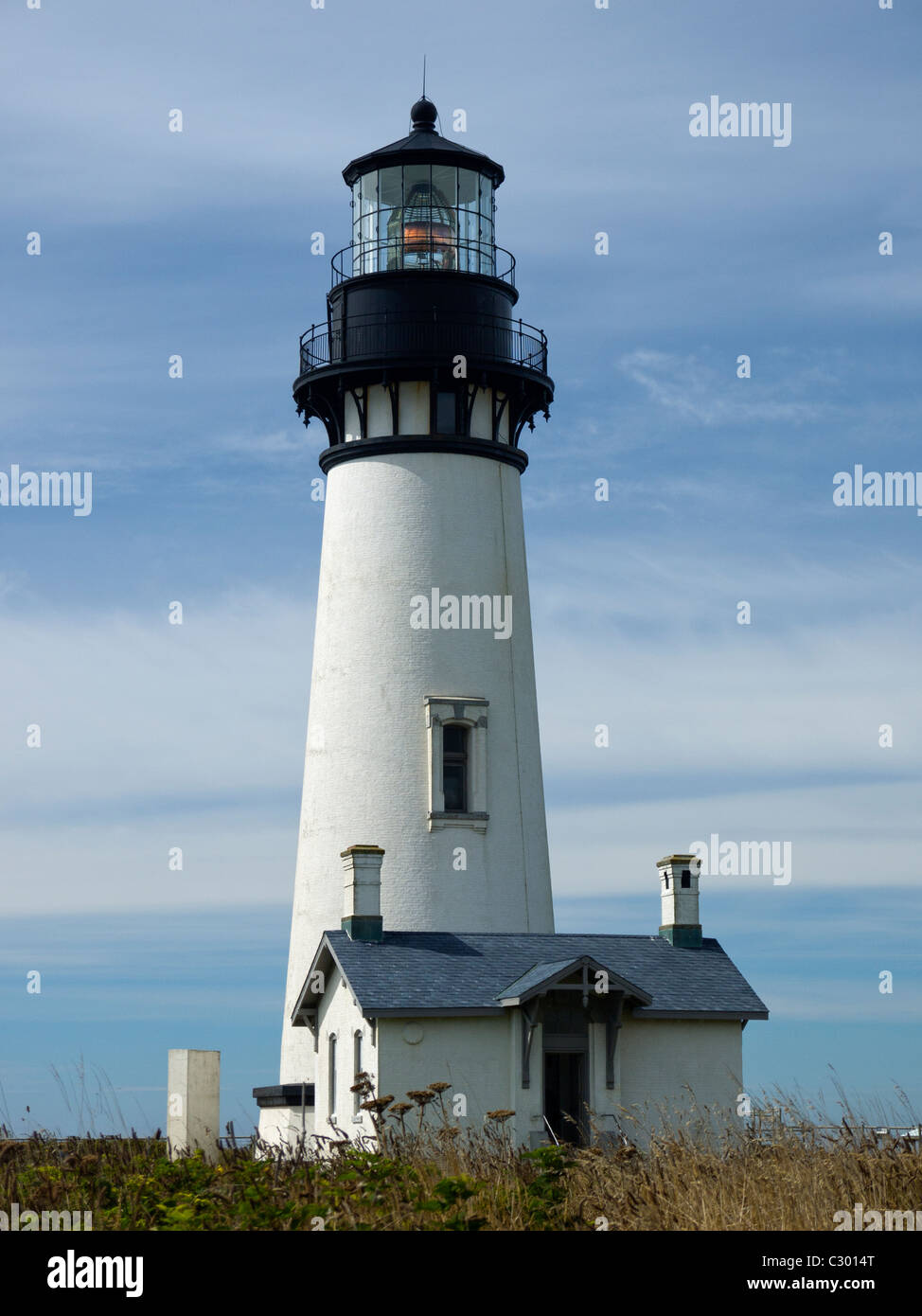Yaquina Head Lighthouse in Newport Oregon which was refurbished and repainted to its original black paint color in 2008 Stock Photo