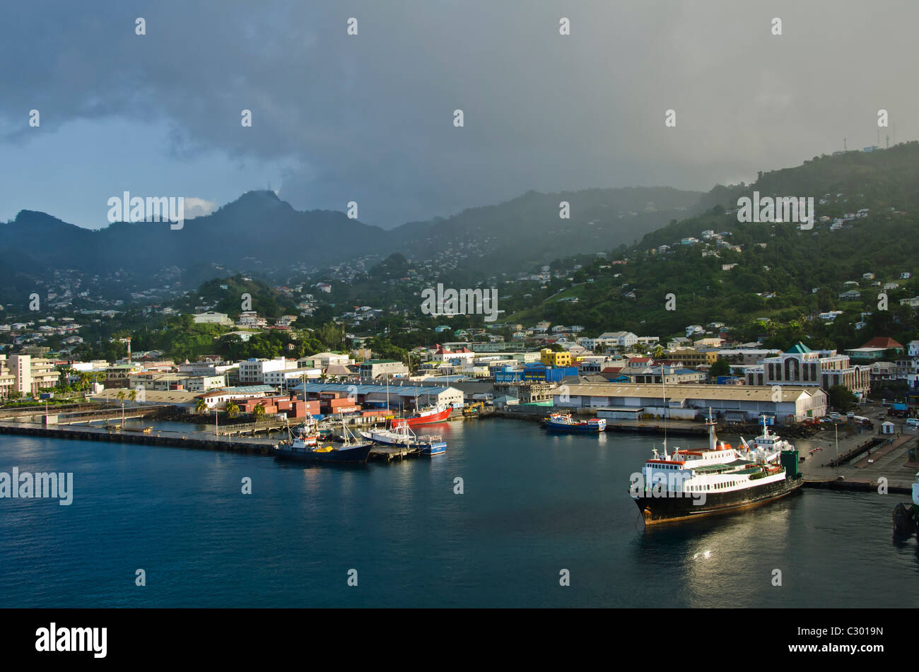 St. Vincent Kingstown harbour wharf rain shower in mountains, St Vincent and Grenadines Stock Photo