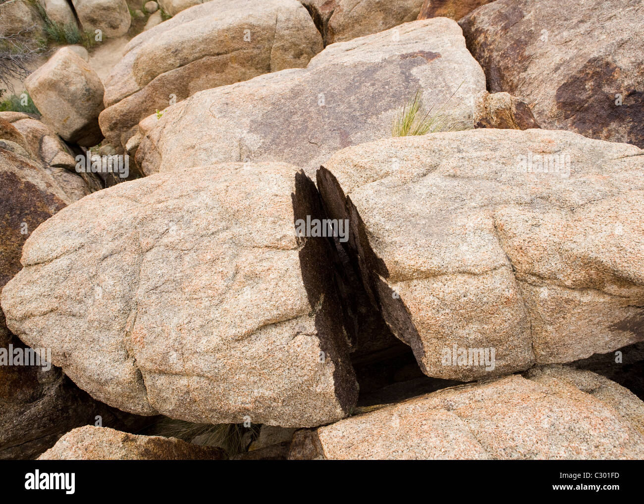 A large granite boulder split in half Stock Photo