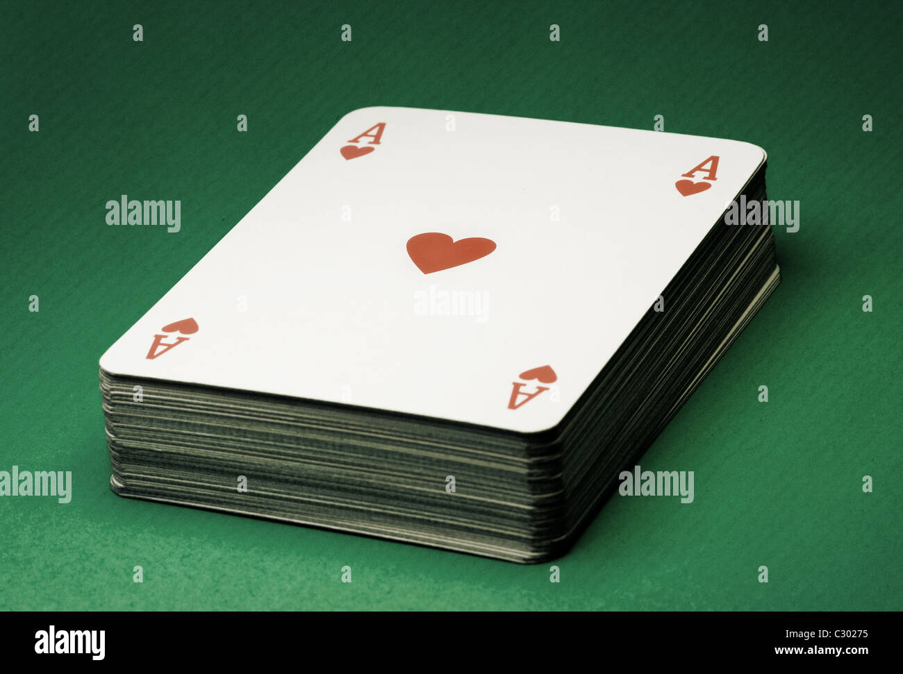 Deck of cards on green table , vintage style photo Stock Photo