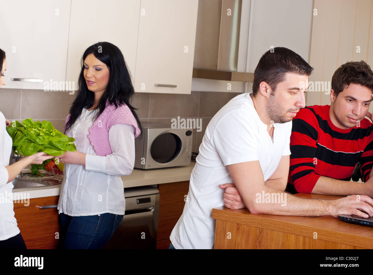 Kitchen Discussion Two couples and discussion hi-res stock photography and images - Alamy