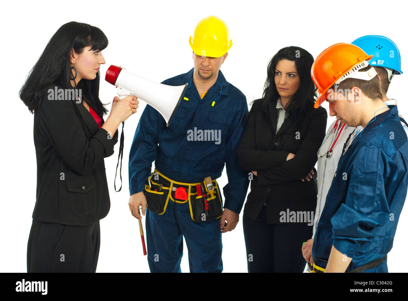 Upset manager woman shouting through megaphone to employees team with different careers against white background Stock Photo