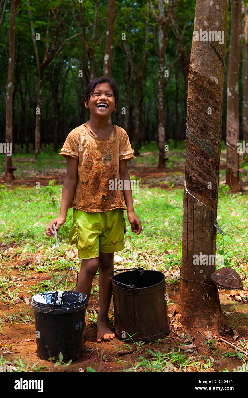 Khmer girl collecting rubber latex - Tbong Khmum Province, Cambodia Stock Photo