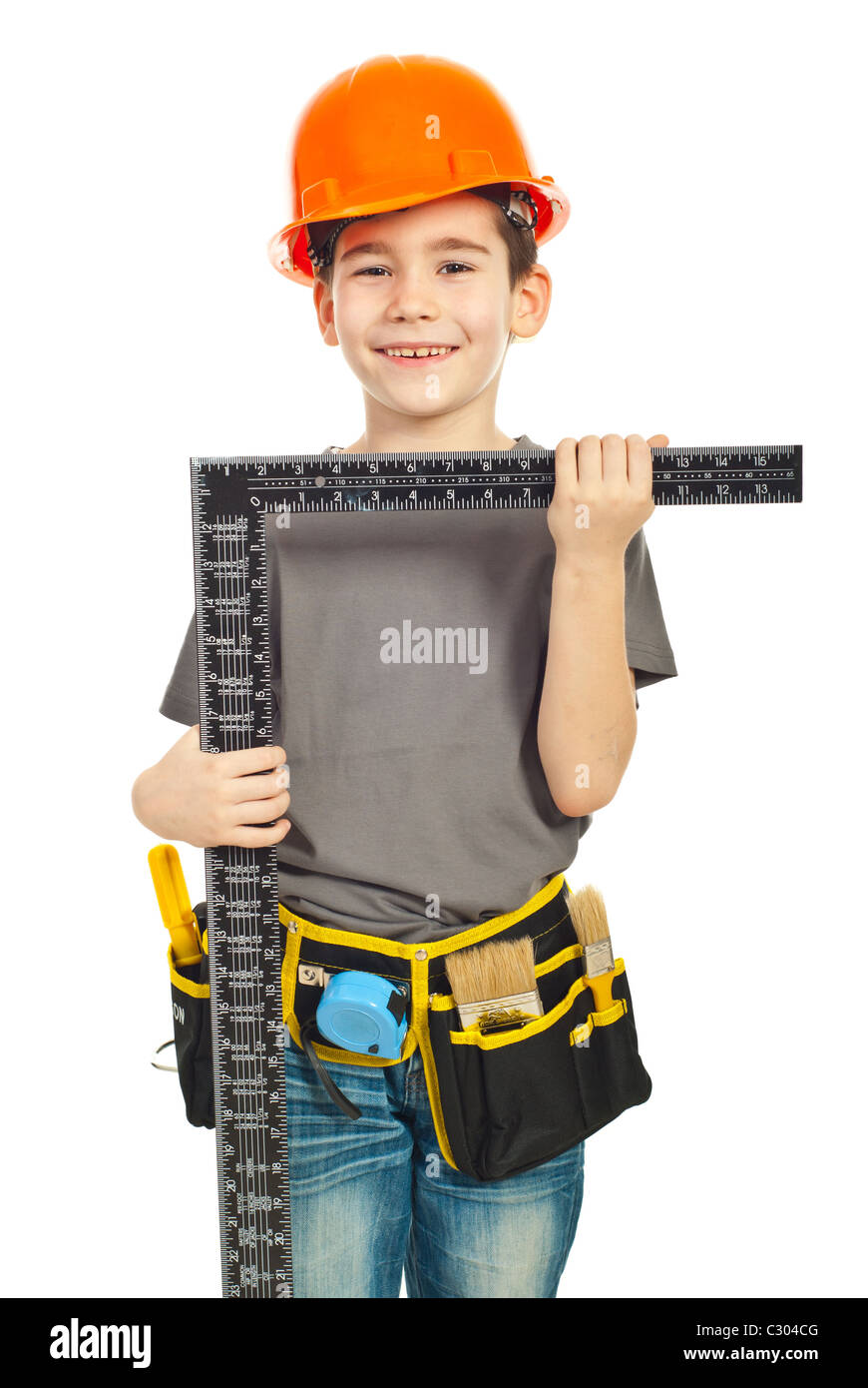 Small boy in uniform and helmet carry a L square ruler isolated on ...
