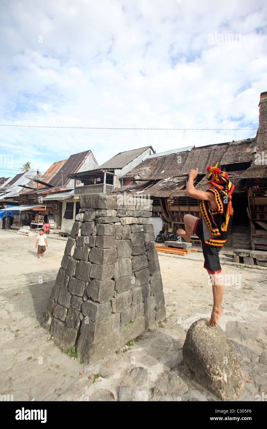 Traditional stone jumping over rock platform in Bawomataluo village on Nias Island. Stock Photo