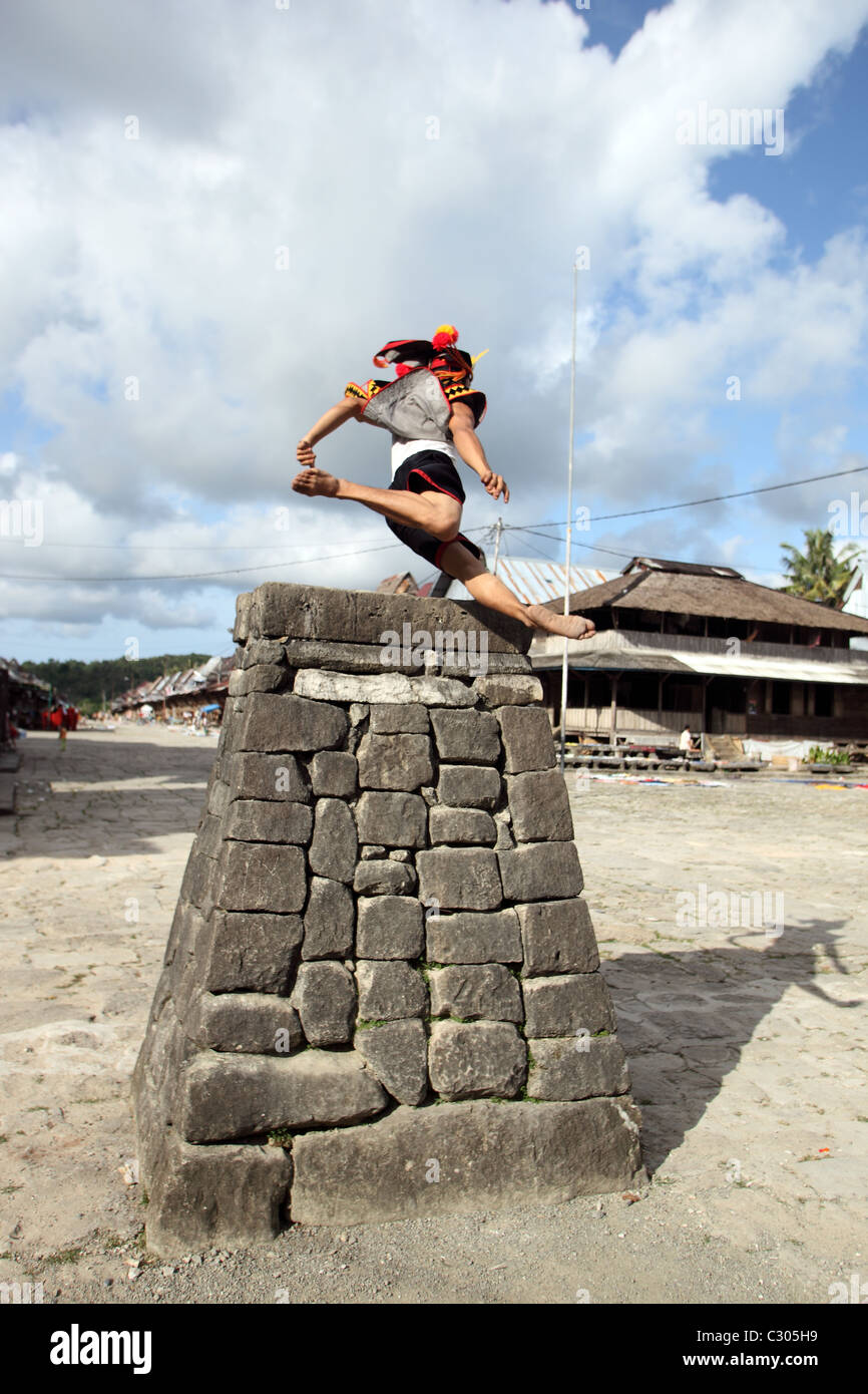 Traditional stone jumping over rock platform in Bawomataluo village on Nias Island. Stock Photo