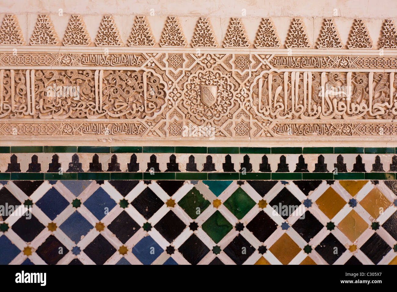 Ornate architectural artwork on courtyard walls of Nasrid Palace Stock Photo