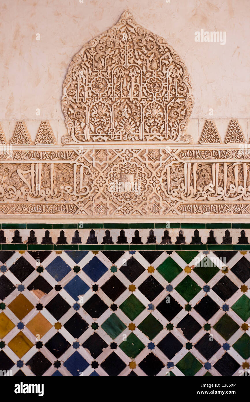 Ornate architectural artwork on courtyard walls of Nasrid Palace Stock Photo