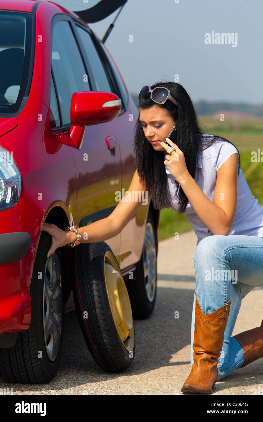 Woman flat tire in car hires stock photography and images Alamy