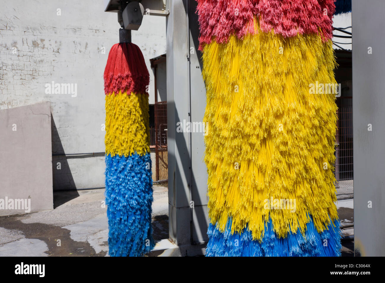 Car wash brushes awaiting business on a motorway services forecourt near Seville, Andalucia