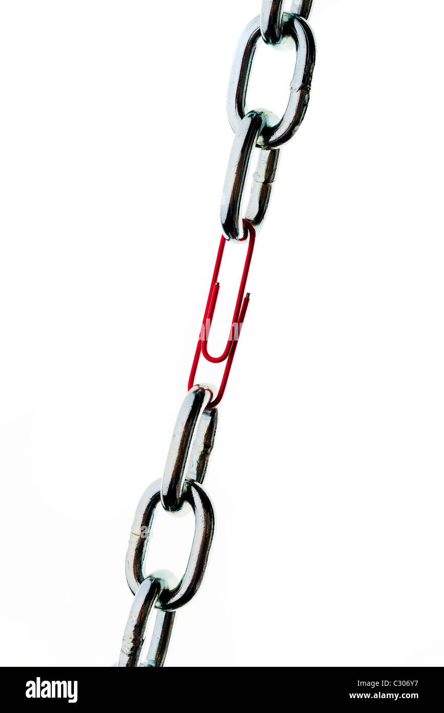 Steel chain is held together by a paperclip Stock Photo