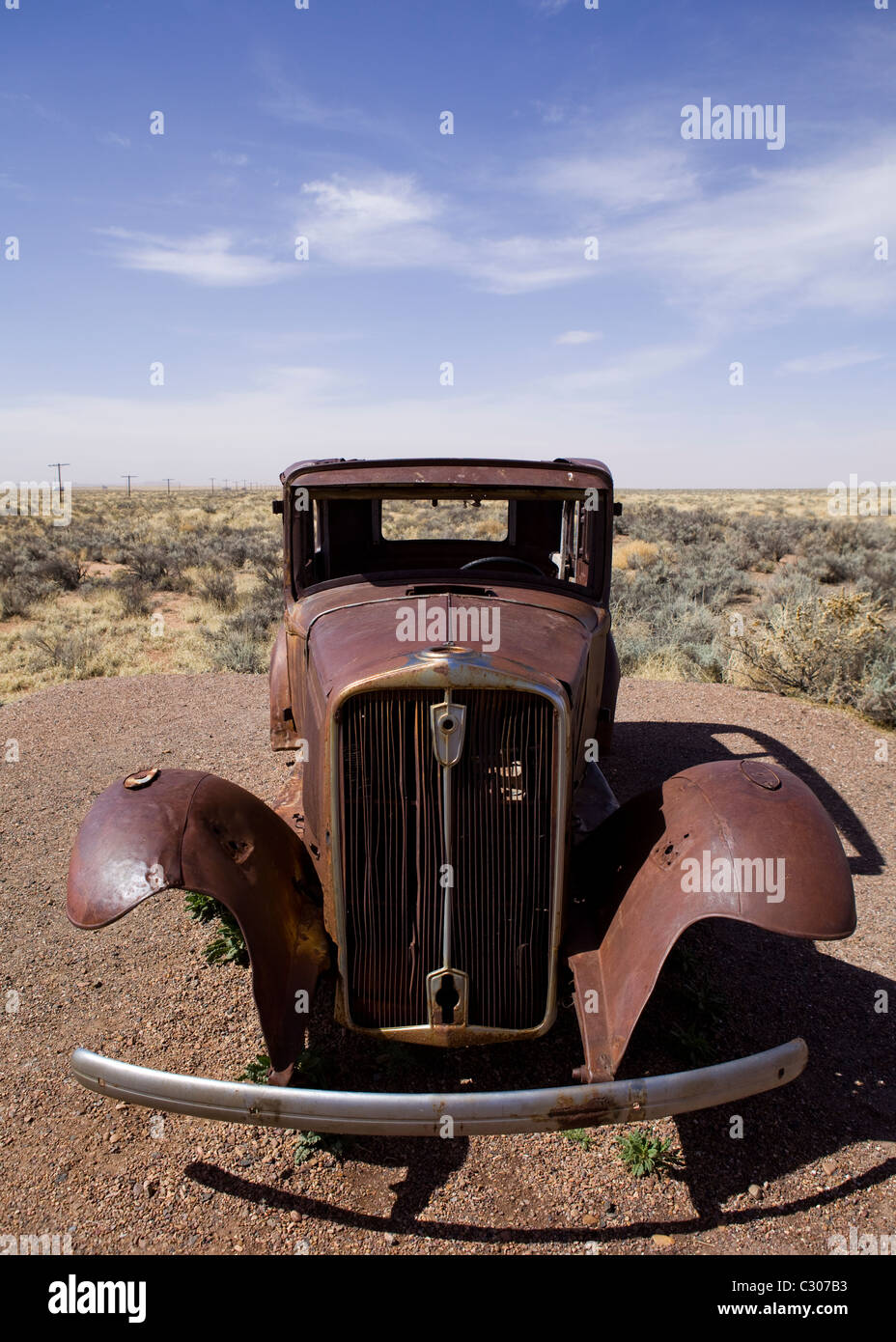 Deserted antique car in the North American desert landscape - Arizona USA Stock Photo