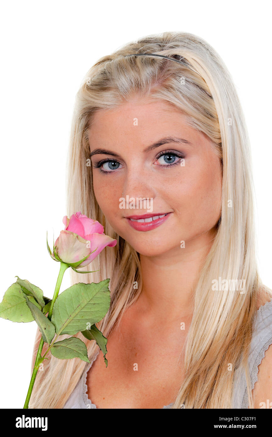 Woman smelling a rose Stock Photo - Alamy