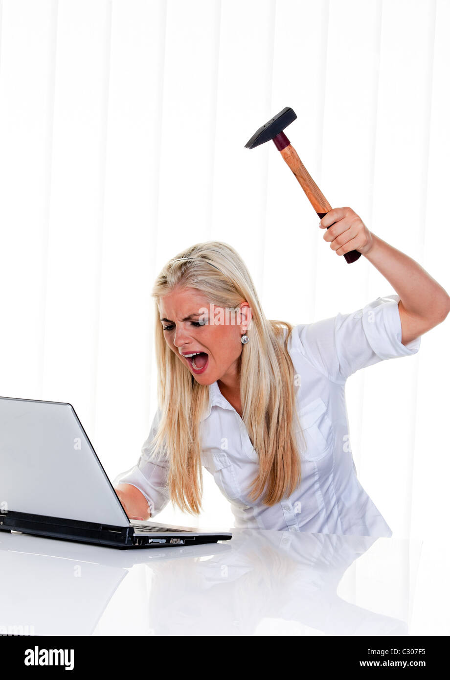 Computer and laptop problems with hammer Stock Photo Alamy