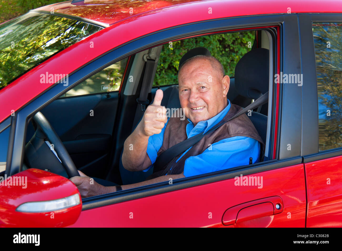 Senior fasting his seat belt Stock Photo Alamy