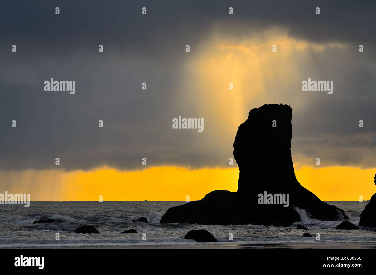 Shaft of light breaks through the cloud at Second Beach Stock Photo