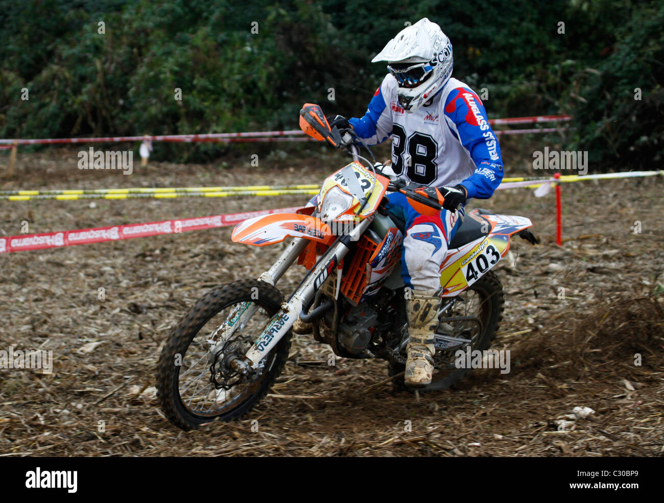 A competitor riding a motorcycle of regularity runs a stretch of ground of a special test Stock Photo