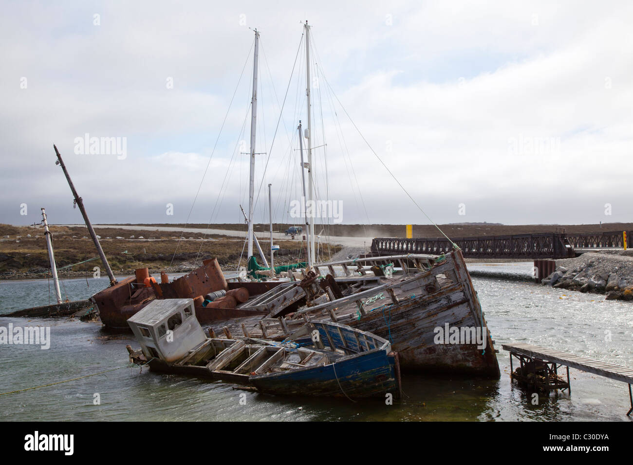 Two listing wooden shipwrecks at Port Stanley, East Falklands Stock Photo