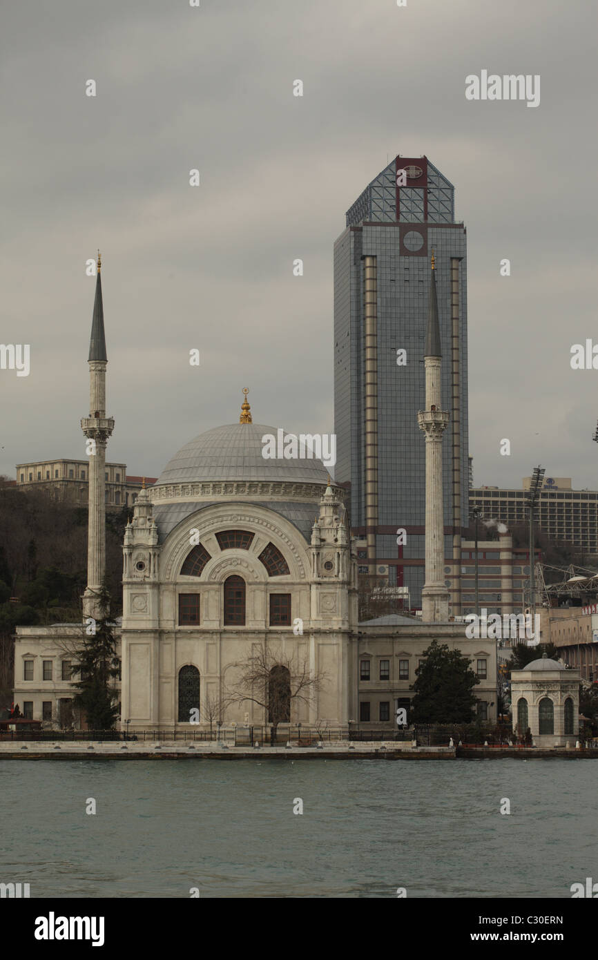 View of the Ottoman Neo-Baroque style Ortaköy Mosque and modern istanbul architecture Stock Photo