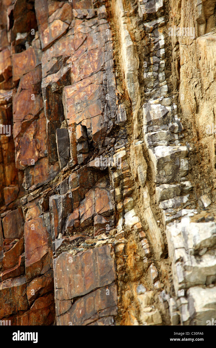 Stone faces of a cutout on a mountain pass Stock Photo