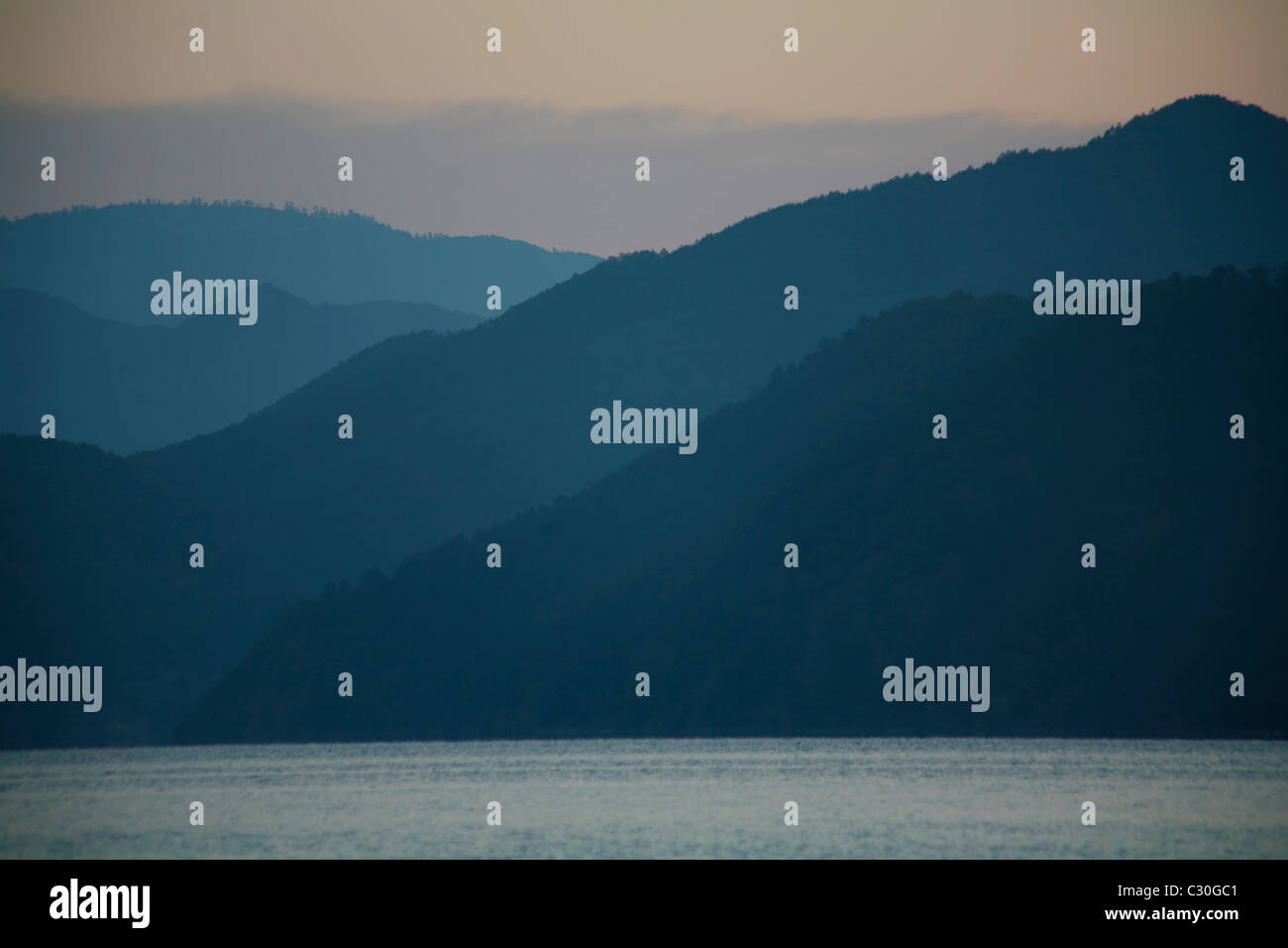 The high alpine Lugu Lake in Yunnan province / China Stock Photo
